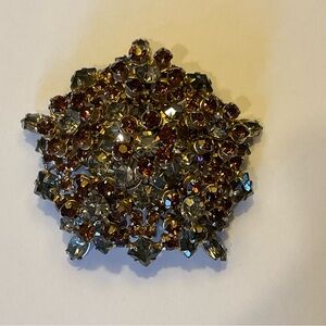 Colored rhinestone brooch.